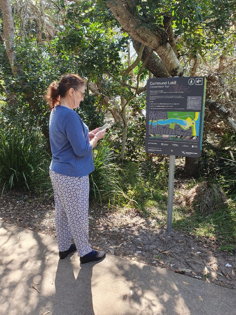 Image of citizen scientist using ClimateWatch app at Currimundi Lake Climate Watch trail